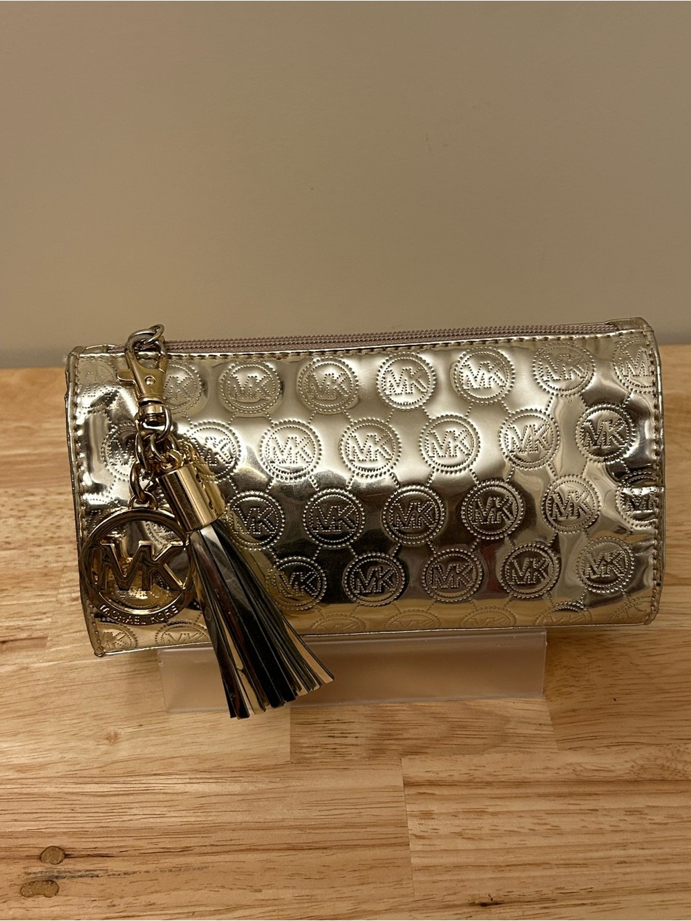 Michael Kors Metallic Gold Embossed Tassel Pouch